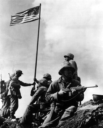 American Soldiers raise the first US flag at  Iwo Jima 1945